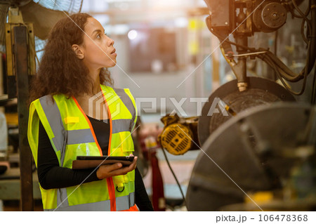 engineer smart woman african black worker check machine condition for safety service maintenance in heavy metal factory engineer smart woman african black worker check machine condition for safety service maintenance in heavy metal factory 106478368