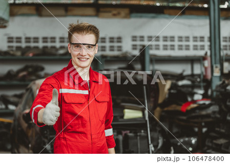 portrait thumbs up happy garage mechanic male worker working fix service maintenance auto vehicle engine portrait thumbs up happy garage mechanic male worker working fix service maintenance auto vehicle engine 106478400