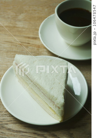 ham cheese sandwich on plate and black coffee cup ham cheese sandwich on plate and black coffee cup 106478547