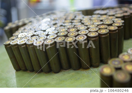 Object made up of spent used cartridge cases. Lots used shells from cartridge cases ammo close up. Model from Many Used cartridge Cases. Concept war military confrontation defense protection firearm Object made up of spent used cartridge cases. Lots used shells from cartridge cases ammo close up. Model from Many Used cartridge Cases. Concept war military confrontation defense protection firearm 106480246