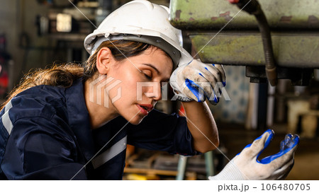 Unhappy mechanical engineer female with problem at factory, Tired worker with hardworking job at industrial plant, High quality photo Unhappy mechanical engineer female with problem at factory, Tired worker with hardworking job at industrial plant, High quality photo 106480705