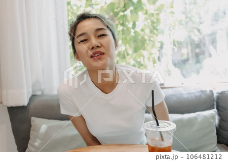 Cute shy girl on a date in the coffee cafe. Cute shy girl on a date in the coffee cafe. 106481212