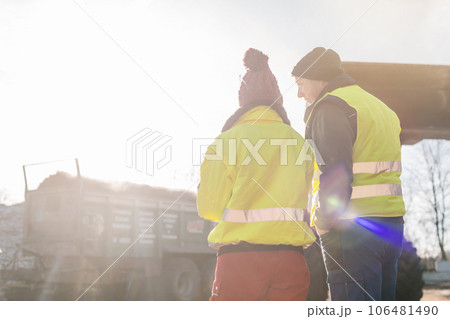 Manager and worker in biomass compost works engaged in discussion Manager and worker in biomass compost works engaged in discussion 106481490