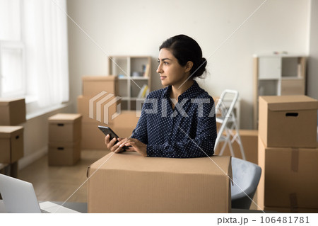 Thoughtful Indian Internet store worker sending purchase to customer Thoughtful Indian Internet store worker sending purchase to customer 106481781