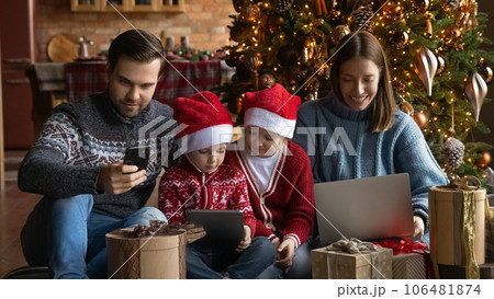 Addicted to modern technology happy family using different gadgets. Addicted to modern technology happy family using different gadgets. 106481874
