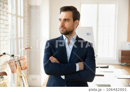 Pensive Caucasian businessman look in distance thinking 106482001