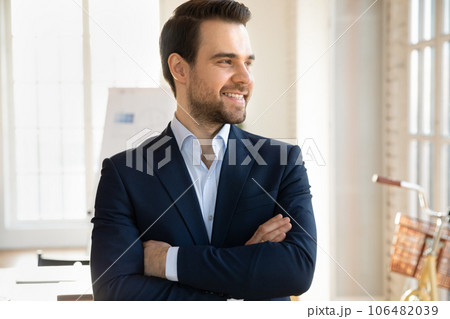 Smiling businessman look in distance thinking or planning Smiling businessman look in distance thinking or planning 106482039
