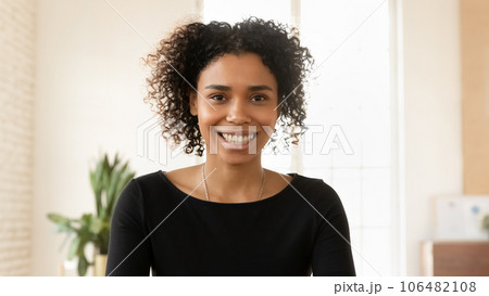 Portrait of smiling biracial woman talk on video call 106482108
