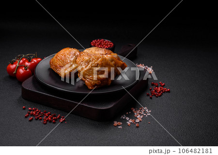 Delicious grilled chicken thighs with salt, spices and herbs 106482181