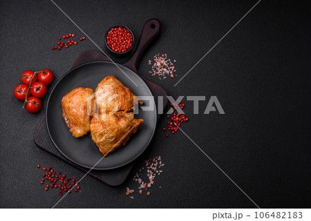 Delicious grilled chicken thighs with salt, spices and herbs 106482183