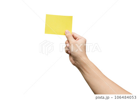 Hand holding yellow paper isolated on white with clipping path. 106484053
