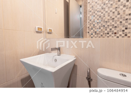 White elegant bathroom with clean marble tile walls interior 106484954