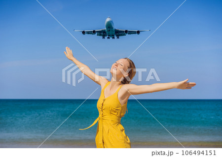Woman have fun on the beach watching the landing planes. Traveling on an airplane concept. Text space. Island Phuket in Thailand. Impressive paradise. Hot beach Mai Khao. Amazing landscape Woman have fun on the beach watching the landing planes. Traveling on an airplane concept. Text space. Island Phuket in Thailand. Impressive paradise. Hot beach Mai Khao. Amazing landscape 106494151