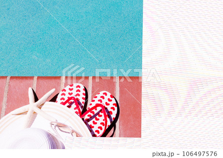Colorful flip flops by a swimming pool. Colorful flip flops by a swimming pool. 106497576