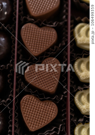 Box of gourmet assorted chocolates ina large box. Box of gourmet assorted chocolates ina large box. 106499359