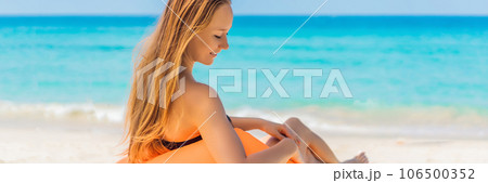 Summer lifestyle portrait of pretty girl sitting on the orange inflatable sofa on the beach of tropical island. Relaxing and enjoying life on air bed BANNER, LONG FORMAT Summer lifestyle portrait of pretty girl sitting on the orange inflatable sofa on the beach of tropical island. Relaxing and enjoying life on air bed BANNER, LONG FORMAT 106500352