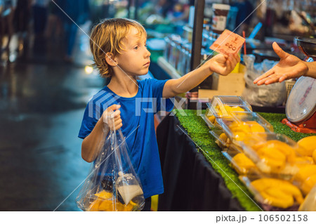 Young boy tourist on Walking street Asian food market Young boy tourist on Walking street Asian food market 106502158