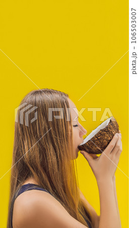 Young woman doing oil pulling over yellow background VERTICAL FORMAT for Instagram mobile story or stories size. Mobile wallpaper 106503007