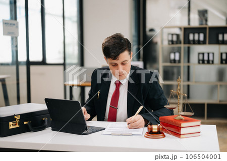 justice and law concept. Mature Male judge in a courtroom on table and Counselor working in modern office... 106504001