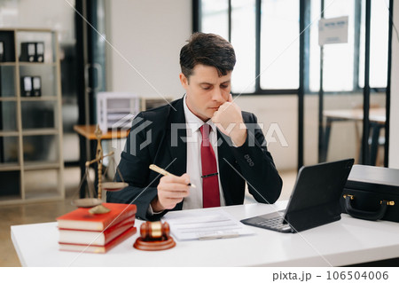 justice and law concept. Mature Male judge in a courtroom on table and Counselor working in modern office... 106504006