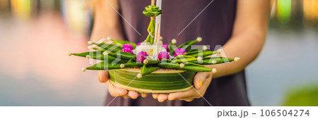 Young woman celebrates Loy Krathong, Runs on the water. Loy Krathong festival, People buy flowers and candle to light and float on water to celebrate the Loy Krathong festival in Thailand BANNER, LONG Young woman celebrates Loy Krathong, Runs on the water. Loy Krathong festival, People buy flowers and candle to light and float on water to celebrate the Loy Krathong festival in Thailand BANNER, LONG 106504274