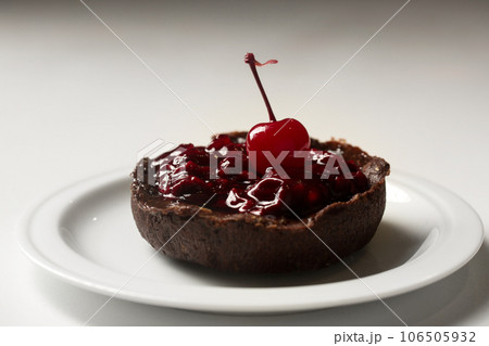 chocolate dessert with lingonberry jam 106505932