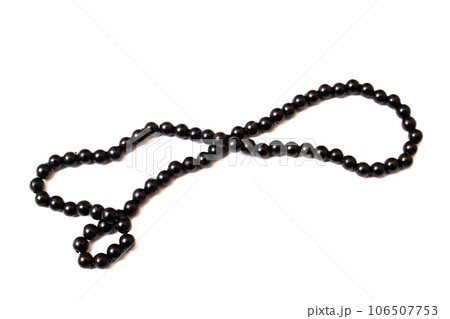 Black beads isolated on white background closeup Black beads isolated on white background closeup 106507753