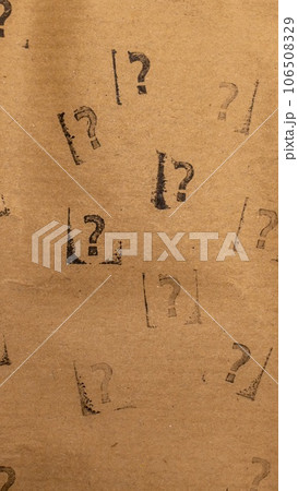 craft paper with many stamped questions marks 106508329
