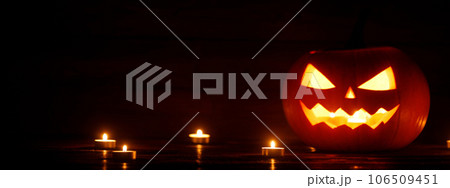 Three Halloween Pumpkins and candles Three Halloween Pumpkins and candles 106509451