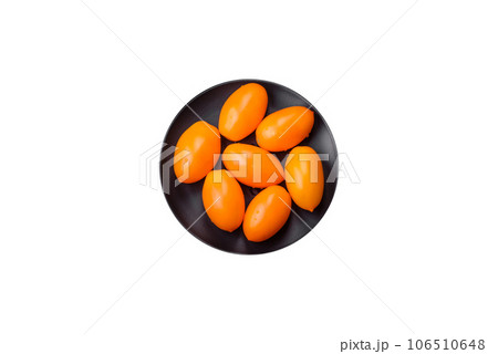 Bright juicy fresh yellow plum-shaped tomatoes. Preparing the tomato sauce Bright juicy fresh yellow plum-shaped tomatoes. Preparing the tomato sauce 106510648