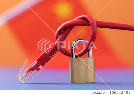 Closed lock on a network wire on the background of the flag, a concept on the theme of the closed Internet in China 106512408
