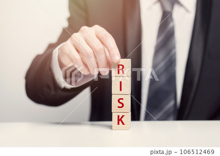Business riks concept, wooden cubes with sing risk 106512469
