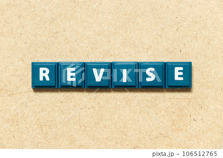 Tile alphabet letter in word revise on wood background Tile alphabet letter in word revise on wood background 106512765