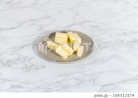 Softened sticks of unsalted butter on in the microwave. Softened sticks of unsalted butter on in the microwave. 106512874