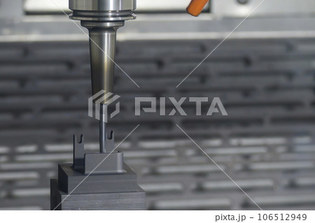 The CNC milling machine cutting the graphite electrode parts. 106512949