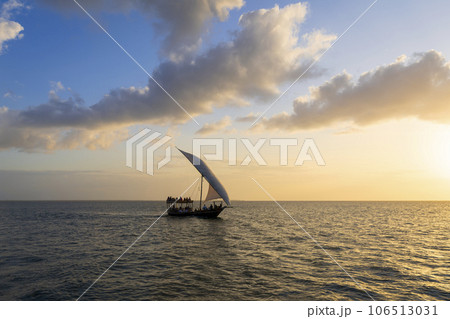 Tourist boat at sunset and background clouds Tourist boat at sunset and background clouds 106513031