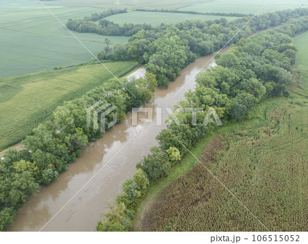 hazy summer morning over flooded Lamine River at Roberts Bluff access in Missouri, aerial view hazy summer morning over flooded Lamine River at Roberts Bluff access in Missouri, aerial view 106515052