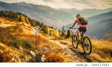 Woman rides sports bike on at mountain trail, person on bicycle Woman rides sports bike on at mountain trail, person on bicycle 106517083