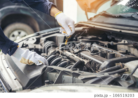 Close up Man hands fixing Car machinery vehicle mechanical service. Mechanic man hands repairing car auto repair shop. open vehicle hood checking up auto mobile. Vehicle Car maintenance engineer. 106519203
