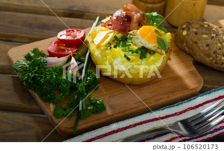 Appetizing baked potato filling with cheese Appetizing baked potato filling with cheese 106520173