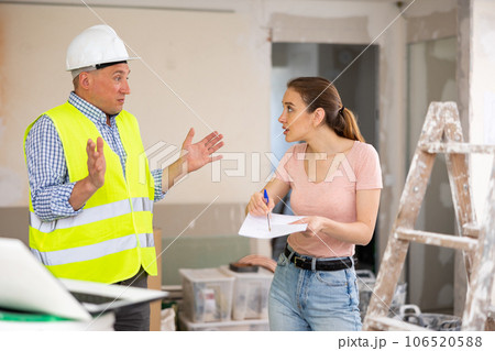 Conflict between annoyed woman architect and foreman Conflict between annoyed woman architect and foreman 106520588