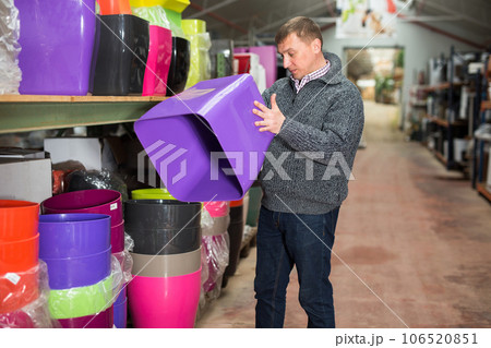 Man choosing pot for plants 106520851