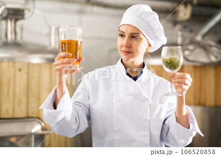 Portrait of woman brewer in beer factory 106520858