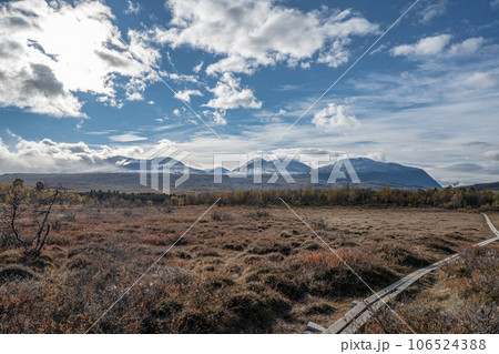 Sunny fall autumn view of Kungsleden Hiking path in Abisko National Park Kiruna Municipality Lapland Sweden 106524388