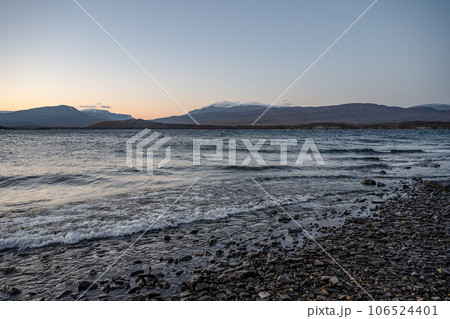Sunset Autumn season in Abisko with Lake Tornetraesk in background, taken from Bjoerkliden, Swedish Lapland, Sweden Sunset Autumn season in Abisko with Lake Tornetraesk in background, taken from Bjoerkliden, Swedish Lapland, Sweden 106524401