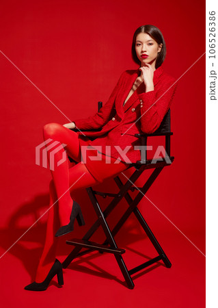 Fashion asian female model in red jacket and skirt. 106526386