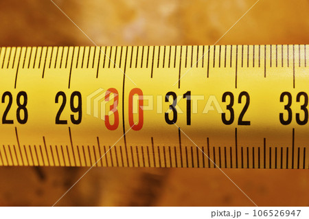 Yellow measure tape detail 106526947