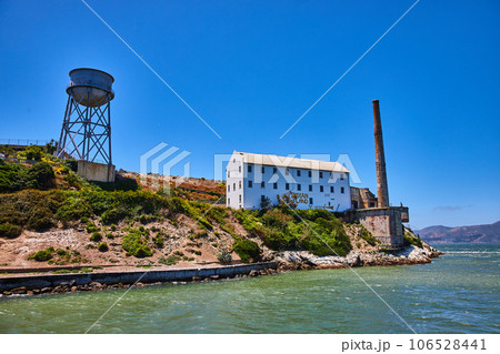 Close up view of Alcatraz Island East side with water tower and white building with Indian Land 106528441