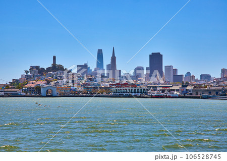 San Francisco shoreline with distant Coit Tower and downtown skyscrapers 106528745