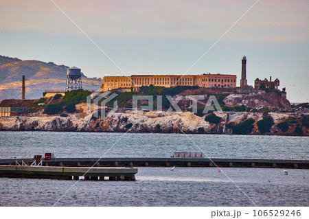 Aquatic Cove and water breaker with close up zoomed in view of Alcatraz Island near sunset 106529246